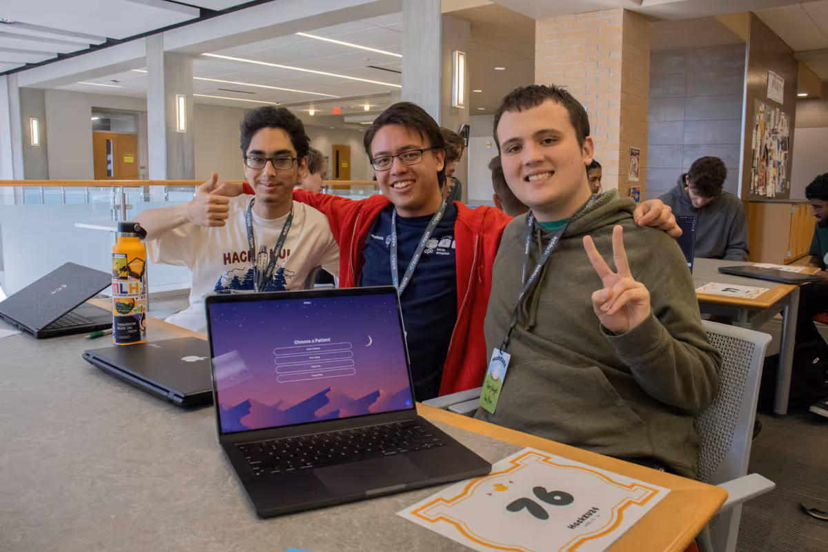 Me and my two teammates posing for a photo during judging at HackKU